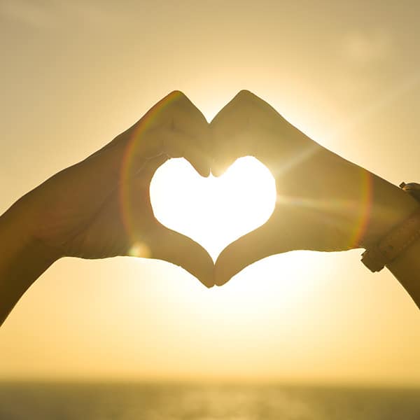 Sunset Heart Hands at Beach