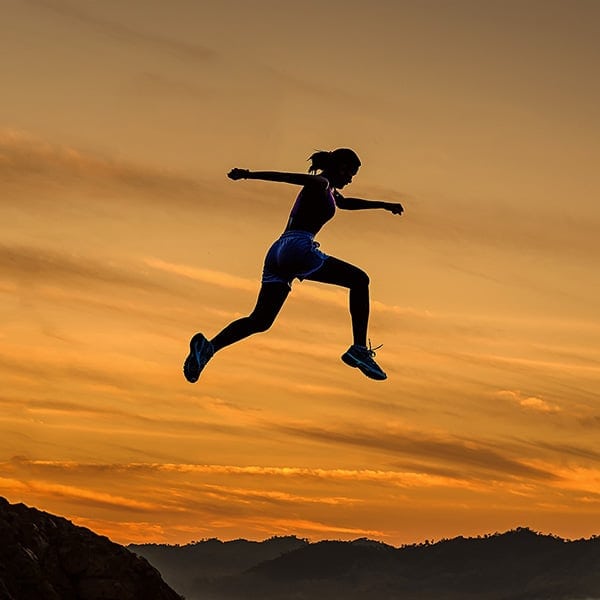 Jumping Girl at Sunset