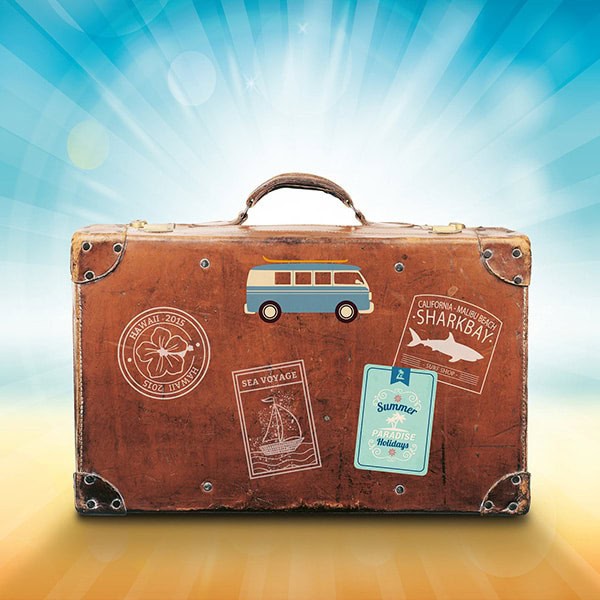 Vintage suitcase with travel stickers and a miniature van, symbolizing adventure and vacation. Perfect for travel, holiday, and exploration themes.