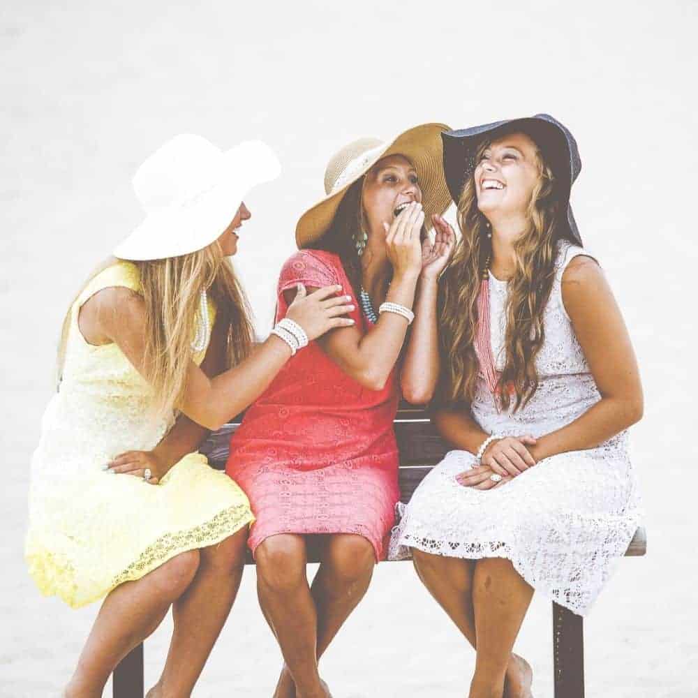 Relaxing with friends on the beach for emotional wellbeing and self care.