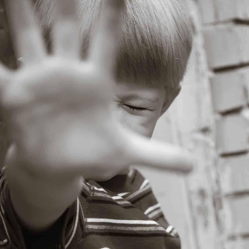 Disgusted Child Covering Face