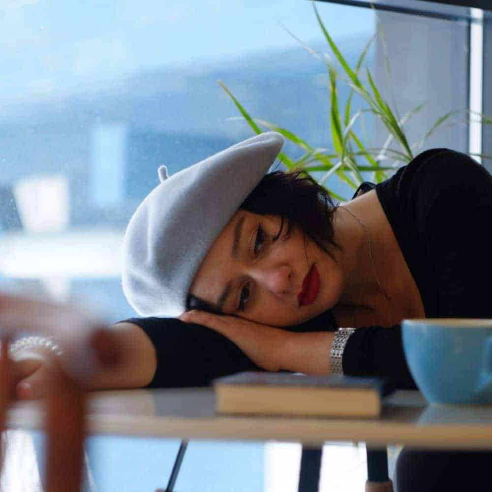 Rested Woman with Head on Table